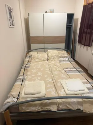 a bed in a room with two towels on it at City Center Apartment Cvijiceva in Belgrade