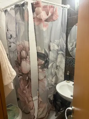a bathroom with a shower curtain and a sink at City Center Apartment Cvijiceva in Belgrade
