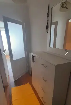 a bathroom with a vanity with a mirror and a door at Summer Edition Belgrade in Belgrade
