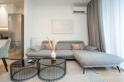a living room with a couch and a table at Velora BW Metropolitan in Belgrade