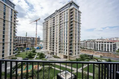a view of a large apartment building from a balcony at Velora BW Metropolitan in Belgrade