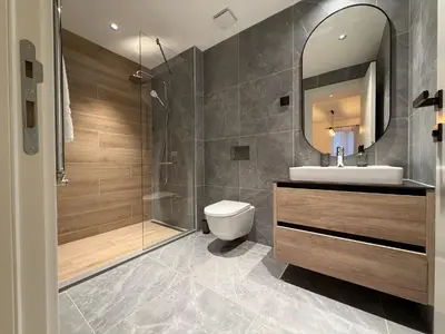 a bathroom with a toilet and a sink and a shower at BW Home in Belgrade