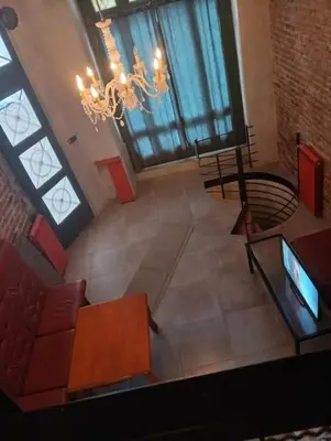an overhead view of a living room with a chandelier at Bar apartment in Belgrade