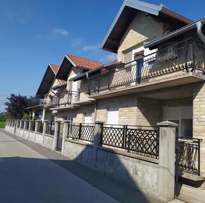a building with balconies on the side of it at Elegance Apartman in Belgrade