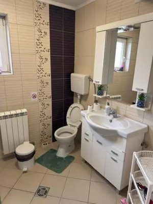 a bathroom with a toilet and a sink at Elegance Apartman in Belgrade