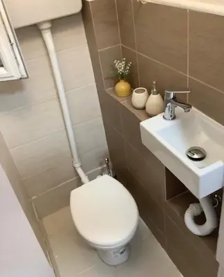 a bathroom with a toilet and a sink at Apartman General in Belgrade