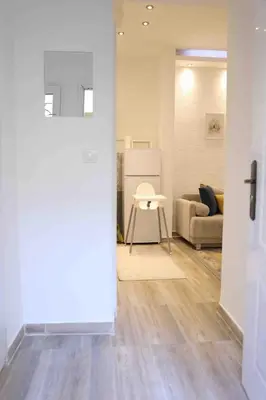 a living room with a couch and a table at VD City Centre Apartment Belgrade in Belgrade
