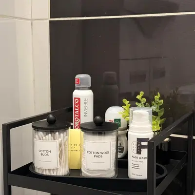 a shelf with many differentiatesiatesiatesiatesiatesktop at Fontana Lux Apartment in Belgrade