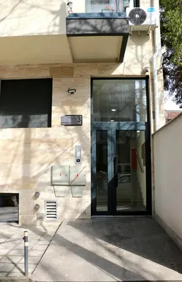 a facade of a building with a glass door at Dok city apartman in Belgrade