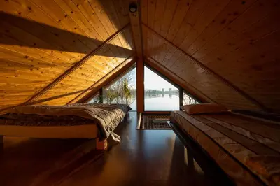 a room with two beds in a wooden attic at Danube Retreat in Belgrade