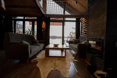 a living room with couches and a fireplace at Danube Retreat in Belgrade