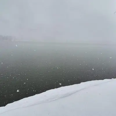 a view of a body of water in the snow at Danube Retreat in Belgrade