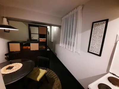 a small room with a table and a dining room at Comfort Studio in Belgrade