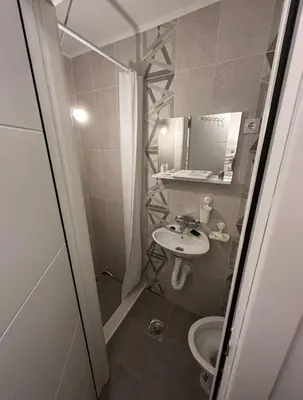a small bathroom with a sink and a toilet at Comfort Studio in Belgrade