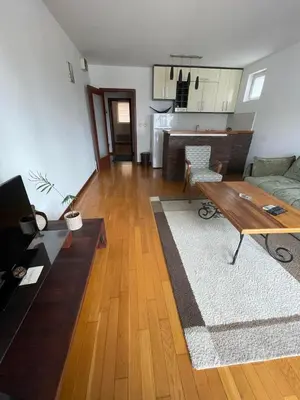 a living room with a couch and a table at Prvi maj in Ub