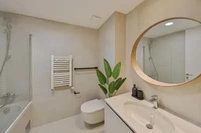 a bathroom with a sink and a toilet and a mirror at BW Exclusive apartment in Belgrade
