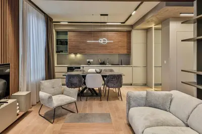 a kitchen and living room with a table and chairs at BW Exclusive apartment in Belgrade