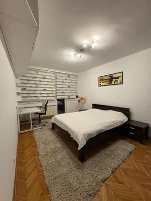 a bedroom with a bed and a desk in it at Apartment MHarmony#Vracar in Belgrade