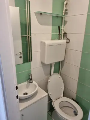 a small bathroom with a toilet and a sink at Apartment MHarmony#Vracar in Belgrade