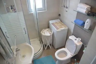 a bathroom with a toilet and a shower and a sink at Apartment Danica in Belgrade