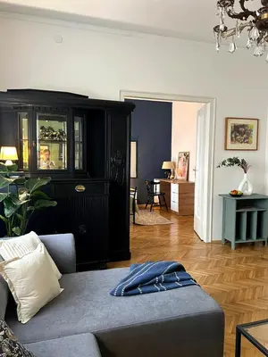 a living room with a couch and a cabinet at Ollio Washington Apart in Belgrade