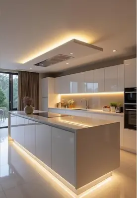 a kitchen with white cabinets and a sink at Capo Zen