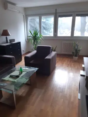 a living room with a couch and a coffee table at Stan in Belgrade