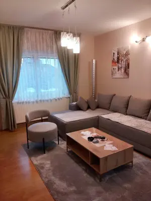 a living room with a couch and a coffee table at Apartman Lola in Lazarevac
