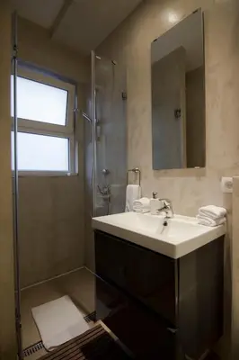 a bathroom with a sink and a shower at Studio Apartment Picasso in Belgrade