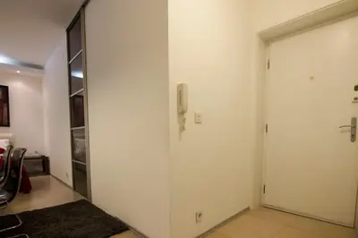 a hallway with a door to a closet at Studio Apartment Picasso in Belgrade