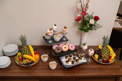 a table with many different types of food on it at Hotel Opera Garni in Belgrade