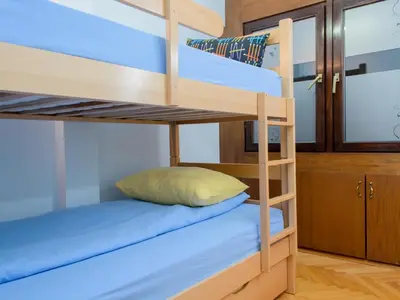 a bunk bed in a room with a bunk bed in a room at Hostel White Town in Belgrade