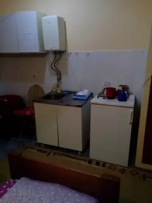 a small kitchen with a sink and a counter at Guest house Mirijevski Konak in Belgrade