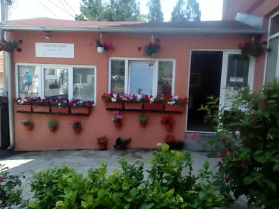 a house with flowers on the side of it at Guest house Mirijevski Konak in Belgrade