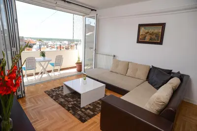 a living room with a couch and a table at Apartments Belvedere in Belgrade