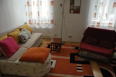 a living room with a couch and a chair at Apartment Angie in Belgrade
