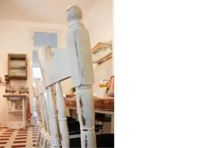 a group of wooden chairs around a table at Apartment Alloga in Belgrade