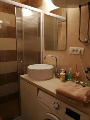 a bathroom with a sink and a shower at Imperia Apartments in Belgrade
