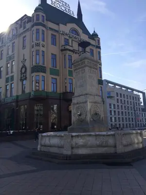 a statue in front of a large building at M&M Downtown Apartment in Belgrade