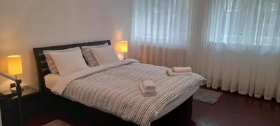 a bedroom with a bed with two towels on it at Apartment Dok in Belgrade