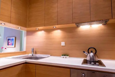 a kitchen with a sink and a tea kettle at Apartment Centro in Belgrade