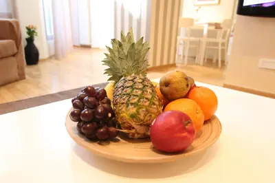 a bowl of fruit sitting on a table at Apartment Centro in Belgrade