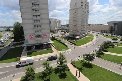 a city with two tall buildings and a street at New Belgrade Apartment Belville, parking 5 evra dan in Belgrade