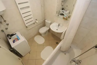 a small bathroom with a toilet and a sink at New Belgrade Apartment Belville, parking 5 evra dan in Belgrade