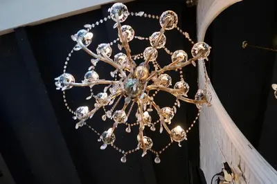 a large chandelier hanging from a ceiling at Belle Apartments - Obilicev Venac in Belgrade
