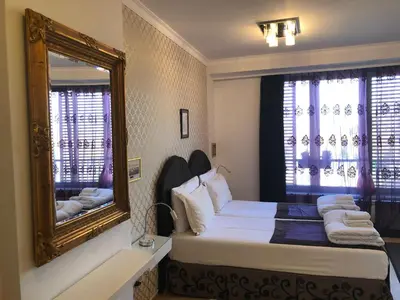 a bedroom with a large mirror and a bed at Belle Apartments-Elegance Apartments in Belgrade