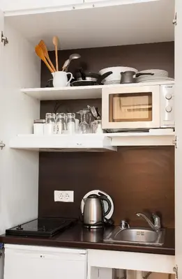 a kitchen with a sink and a microwave at Belle Apartments-Elegance Apartments in Belgrade