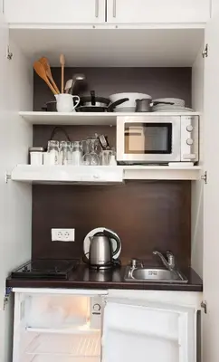a kitchen with a stove and a microwave at Belle Apartments-Elegance Apartments in Belgrade