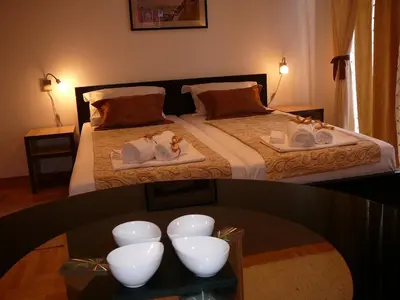 a bedroom with a bed with white bowls on it at Belle Apartments - Luxury Apartments in Belgrade