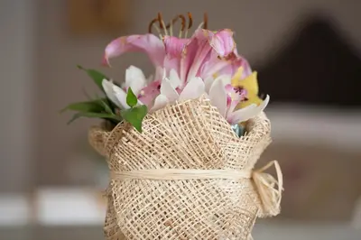 a bouquet of flowers in a burlap bag at Belle Apartments - Luxury Apartments in Belgrade